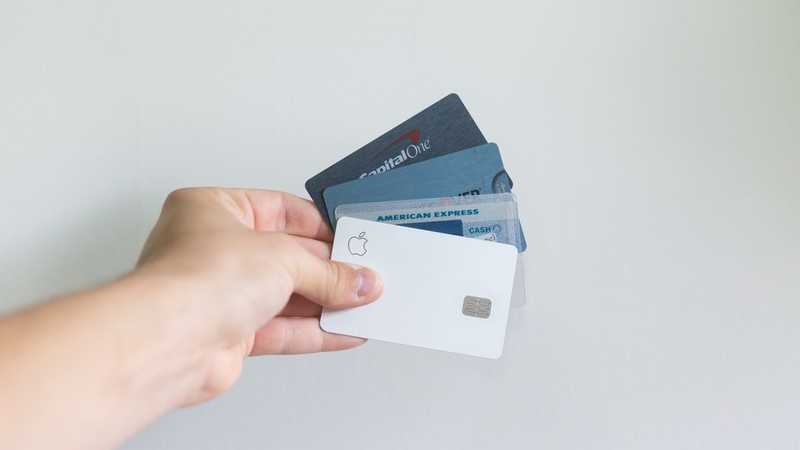 A hand with a lot of credit cards. None with particularly good benefits.